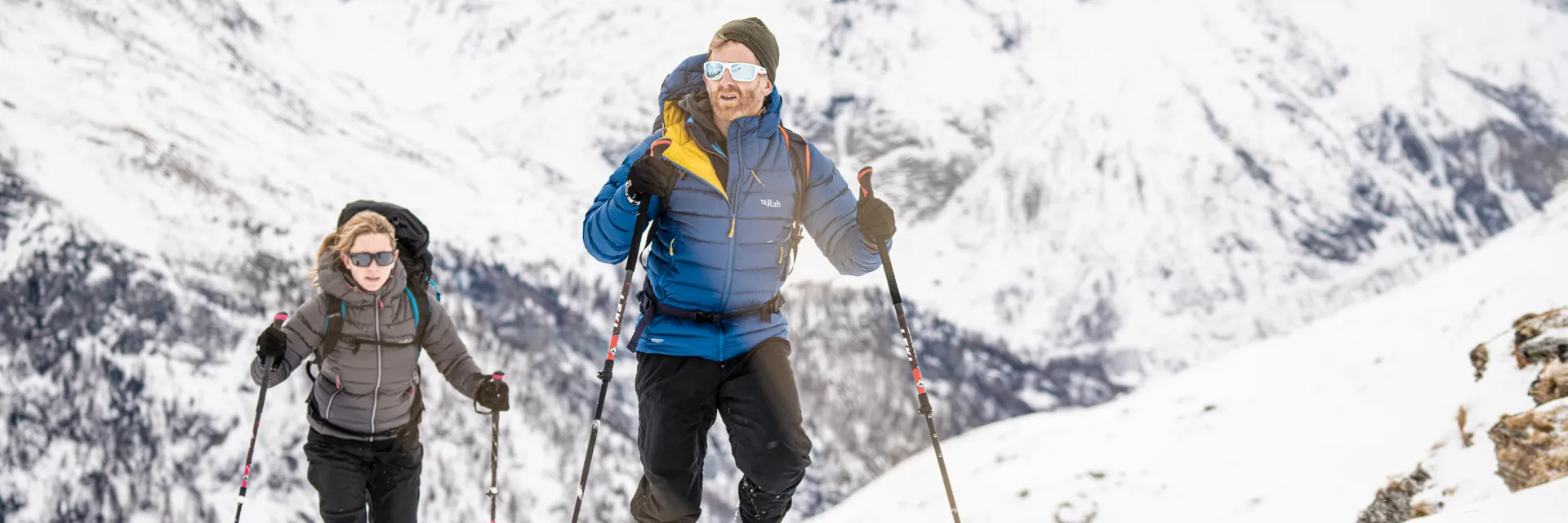 nikwax-couple-walking-down-jackets-snow-1920px Nikwax Couple Walking Down Jackets Snow 1920px